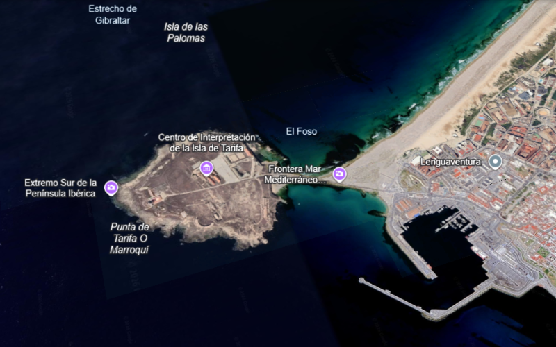 Tarifa coastline with wide sandy beaches, turquoise water, and views toward Africa, a popular coastal destination visited by Wahoo Divers Malaga.