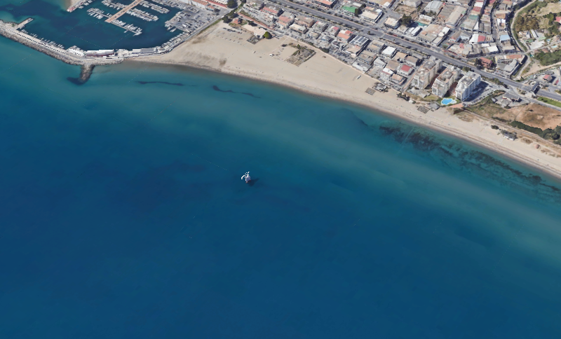 Tower crane rising above a construction site in Marbella with clear skies and coastal urban scenery, photographed near projects visited by Wahoo Divers Malaga.